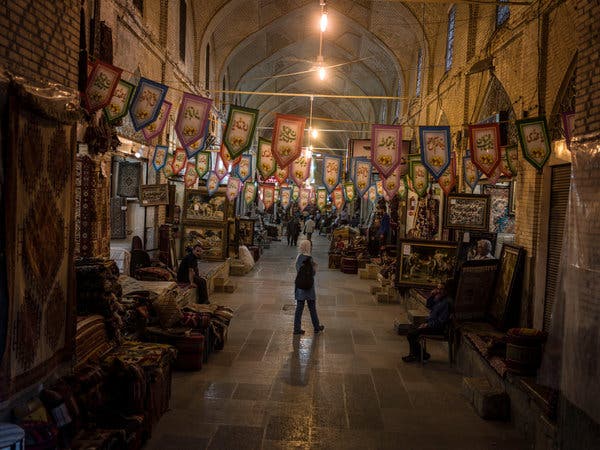 The century-old bazaar in Shiraz, an ancient Iranian city known for its production of hand-woven carpets.